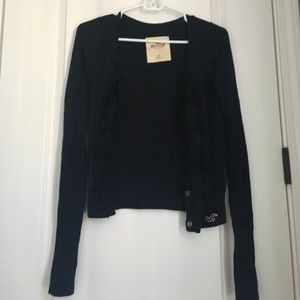 Navy sweater with ruffles‎ and buttons